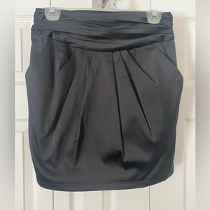 Short black satin skirt with pockets and bow in back, size M
